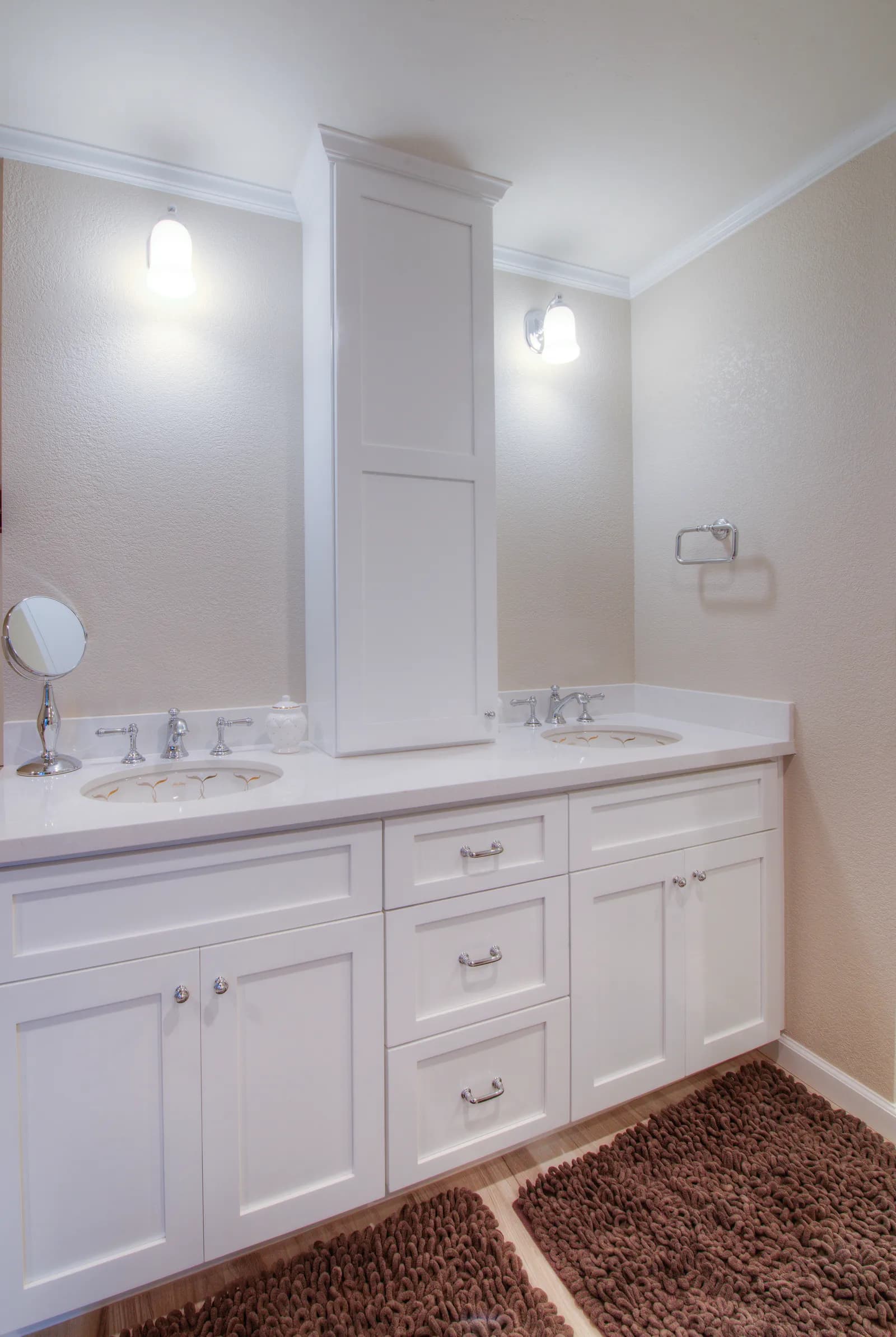 Contemporary bathroom featuring dual sinks with generous counter space and lighting.