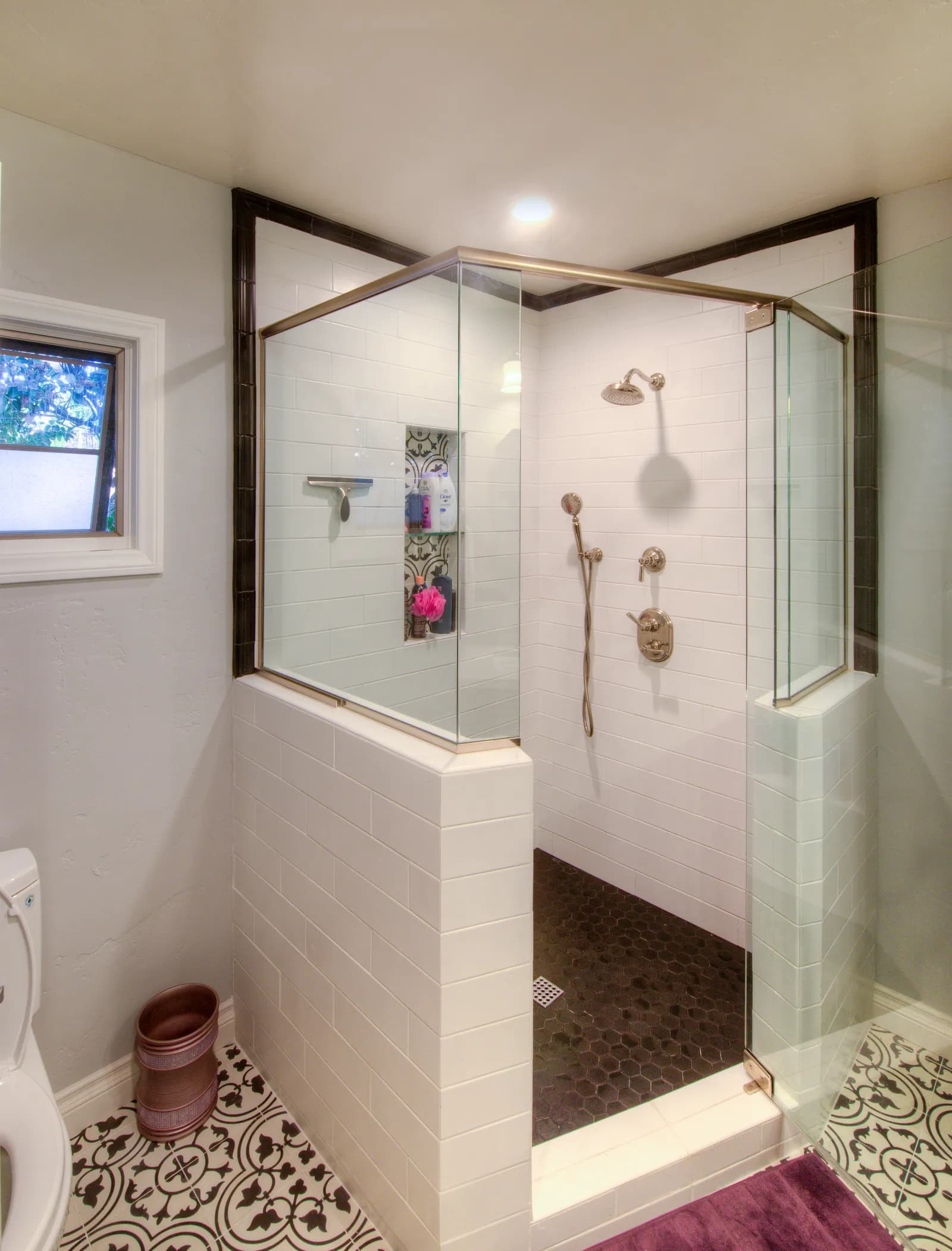 Luxurious bathroom with large walk-in shower featuring tile walls and rainfall showerhead.