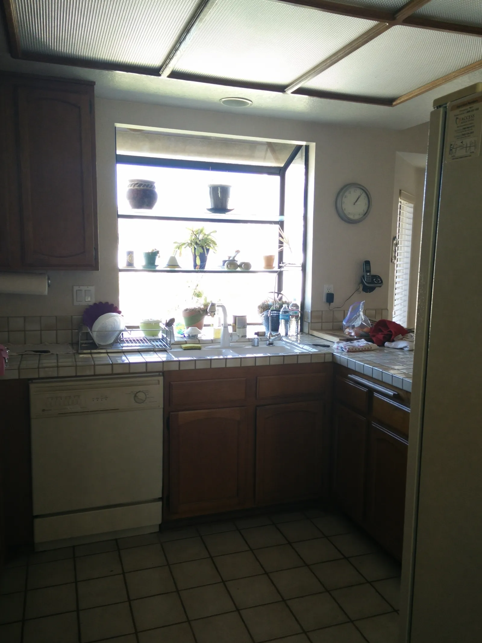 Large walk-in closet with organized clothing racks, shelving, and storage systems.