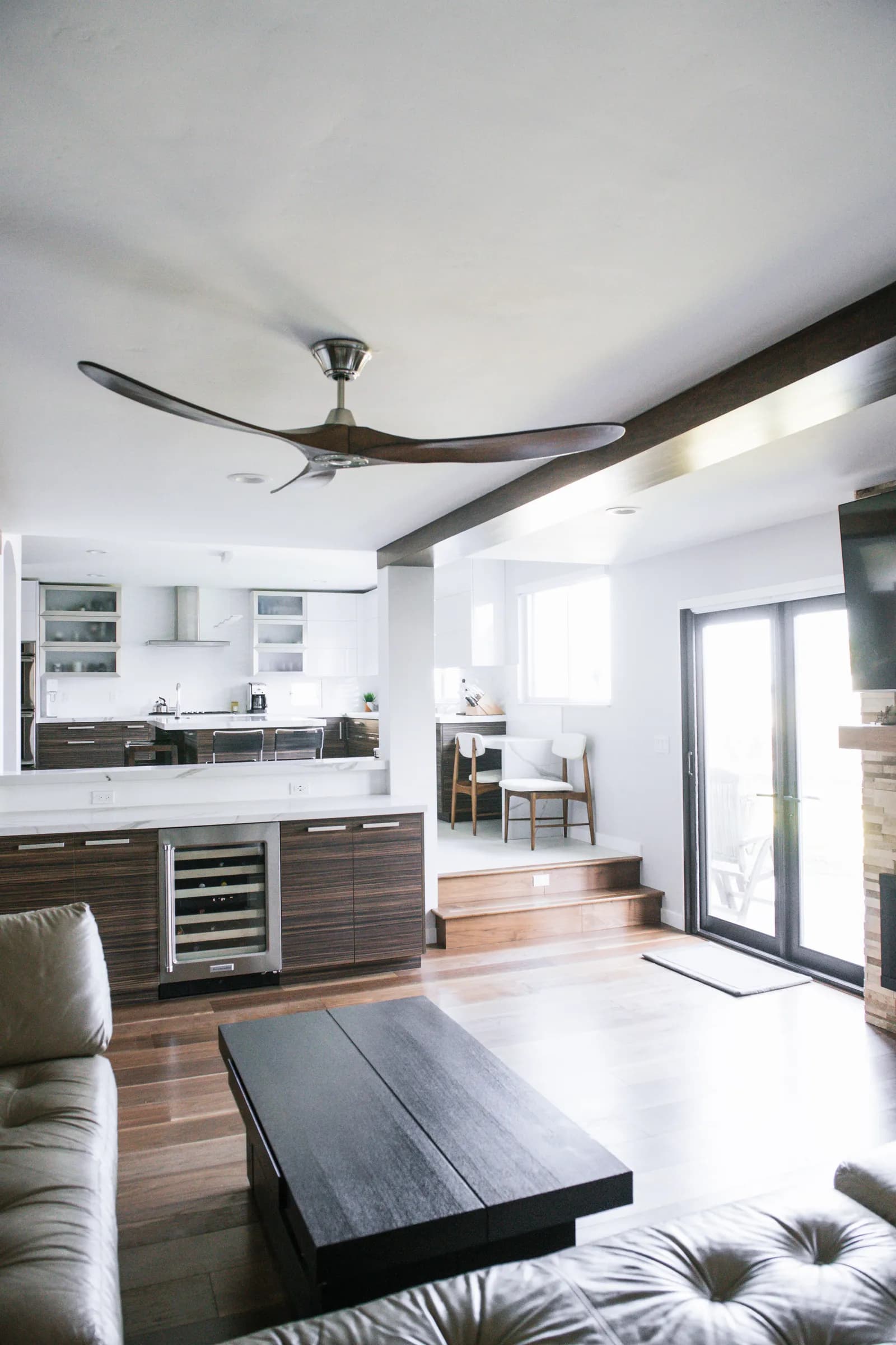Bright modern interior with open-concept kitchen, dining, and living spaces.