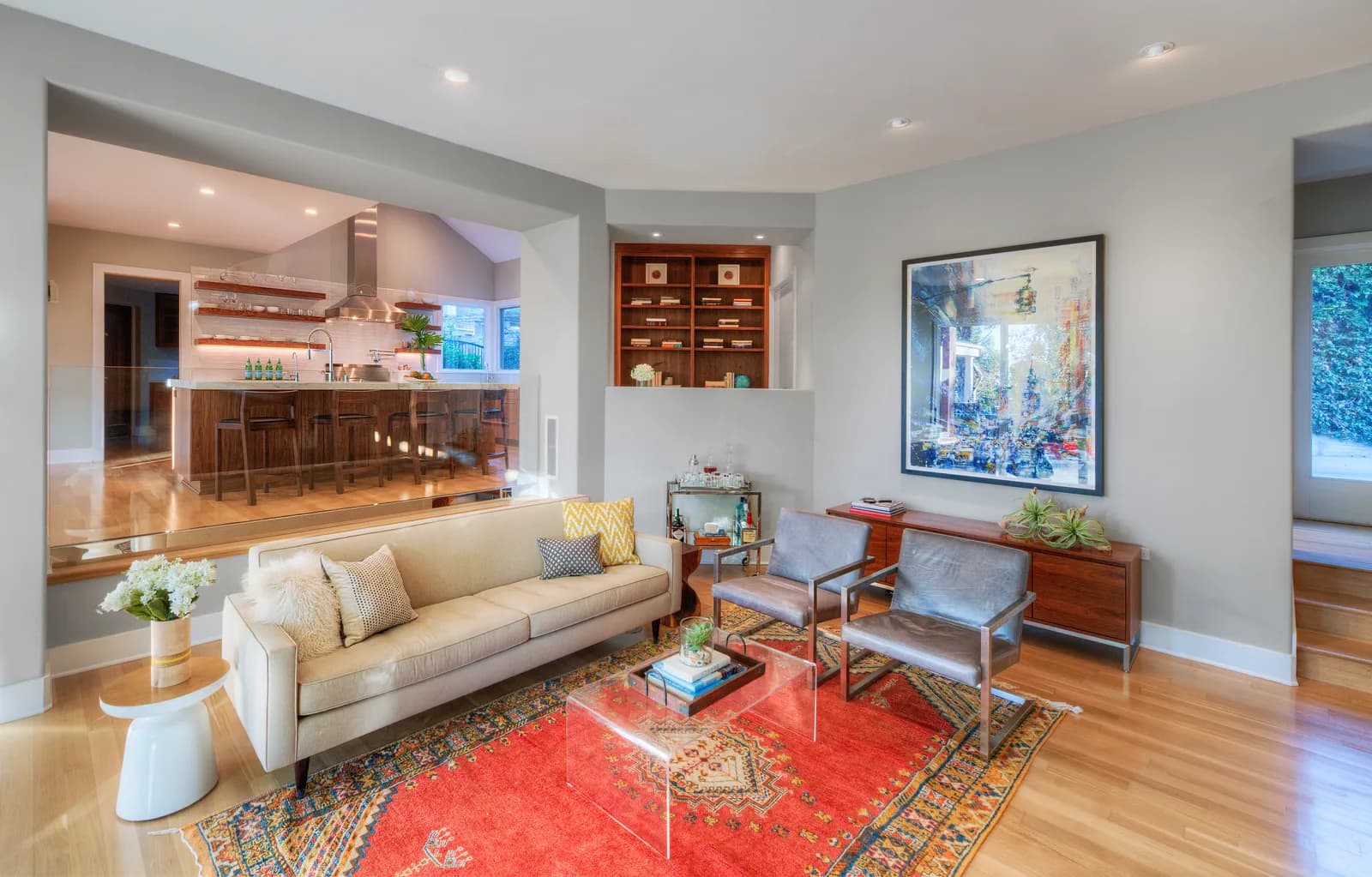 Open-plan living and kitchen space in a remodeled home.