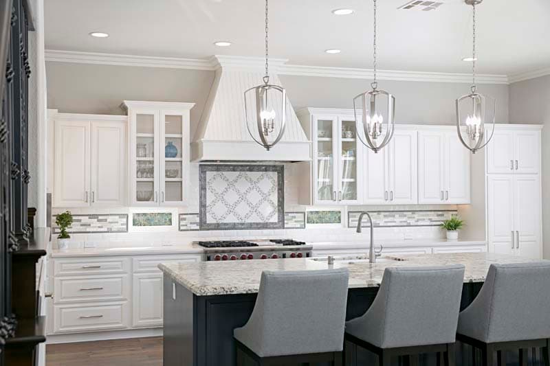 A light, open-plan remodeled kitchen with modern finishes.